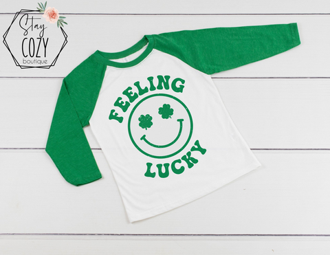 Feeling Lucky Smiley Youth Raglan | St. Patrick’s Day🍀 | The Lucky Collection | Stay Cozy Boutique